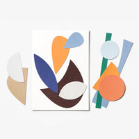 Abstract geometric collage paper cut out shapes displayed on a clean white background