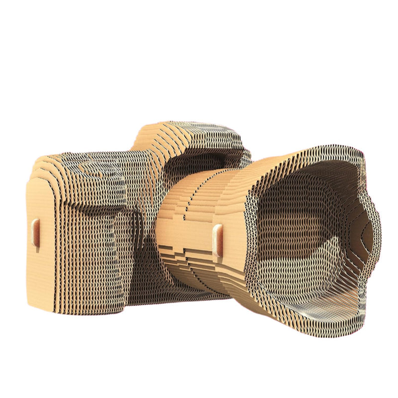 A cardboard model of a camera on a white background.
