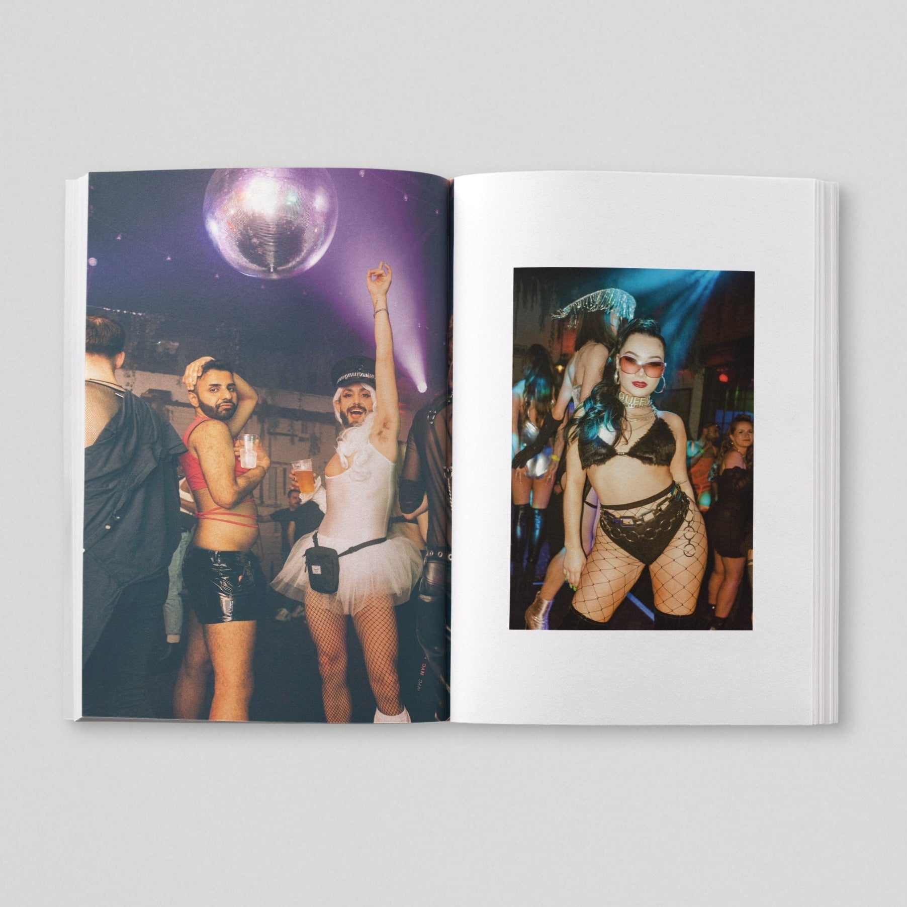 Open page of Queer London book featuring a photograph of people dancing under a disco ball.