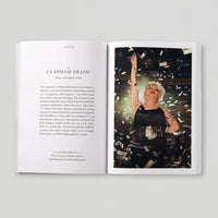 Open page of Queer London book featuring a photograph of a person on a stage with confetti raining down.