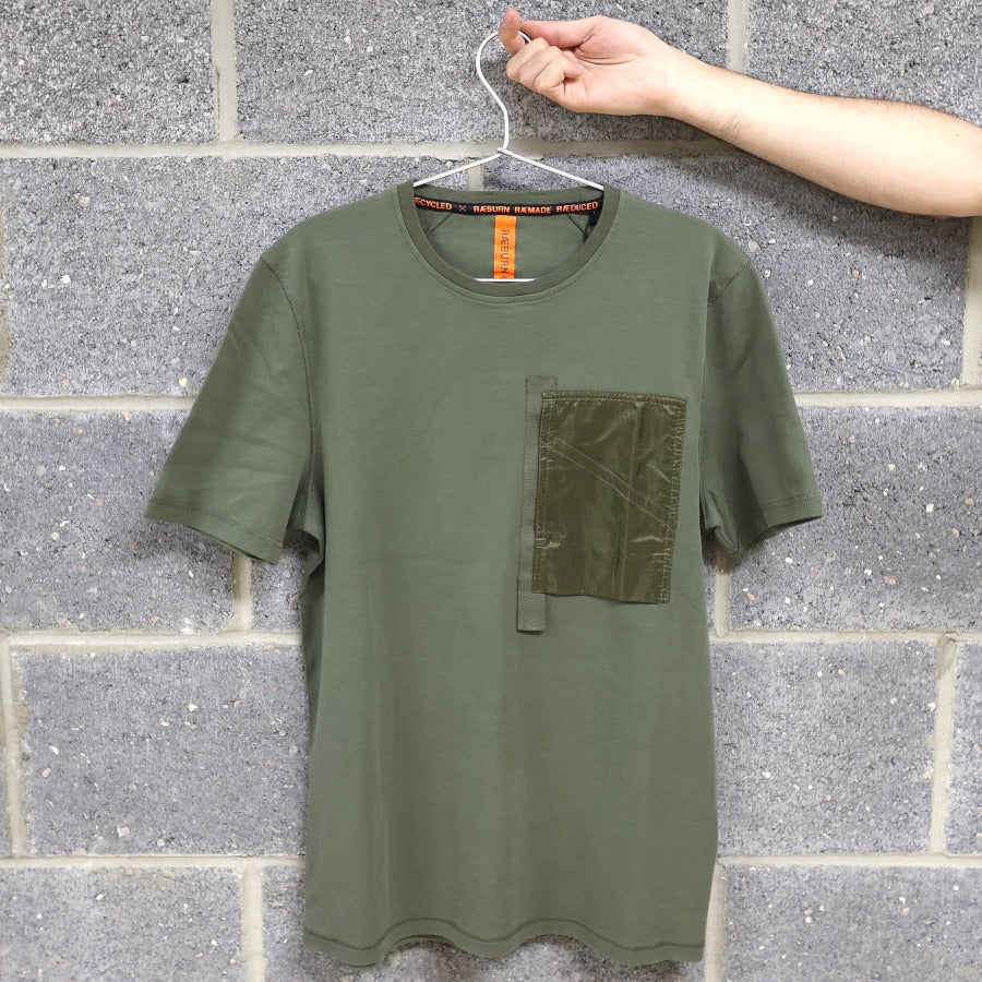 green t shirt on a brick wall background