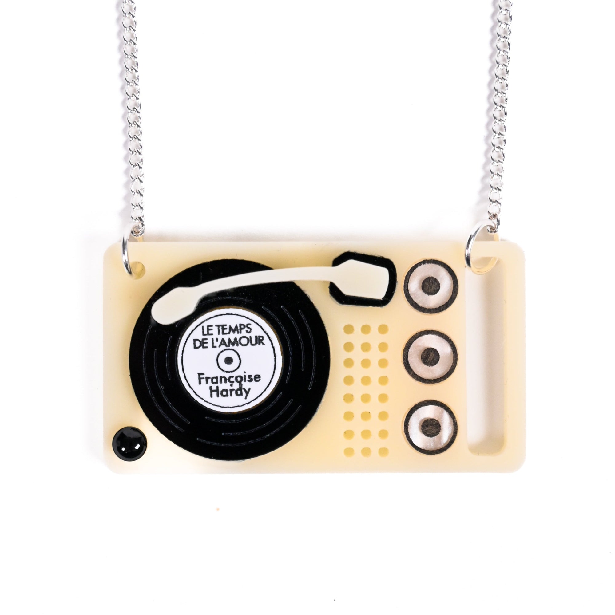 Record player-shaped necklace with a chain on a white background