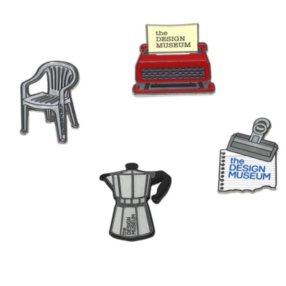 Set of four enamel pins featuring a chair, typewriter, Moka pot, and notebook with 'The Design Museum' branding on a white background.