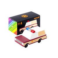 Toy van with a colorful box on a white background