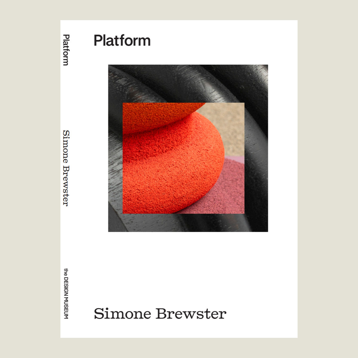 Book cover of Simone Brewster exhibition catalogue with a white border and black and orange abstract design