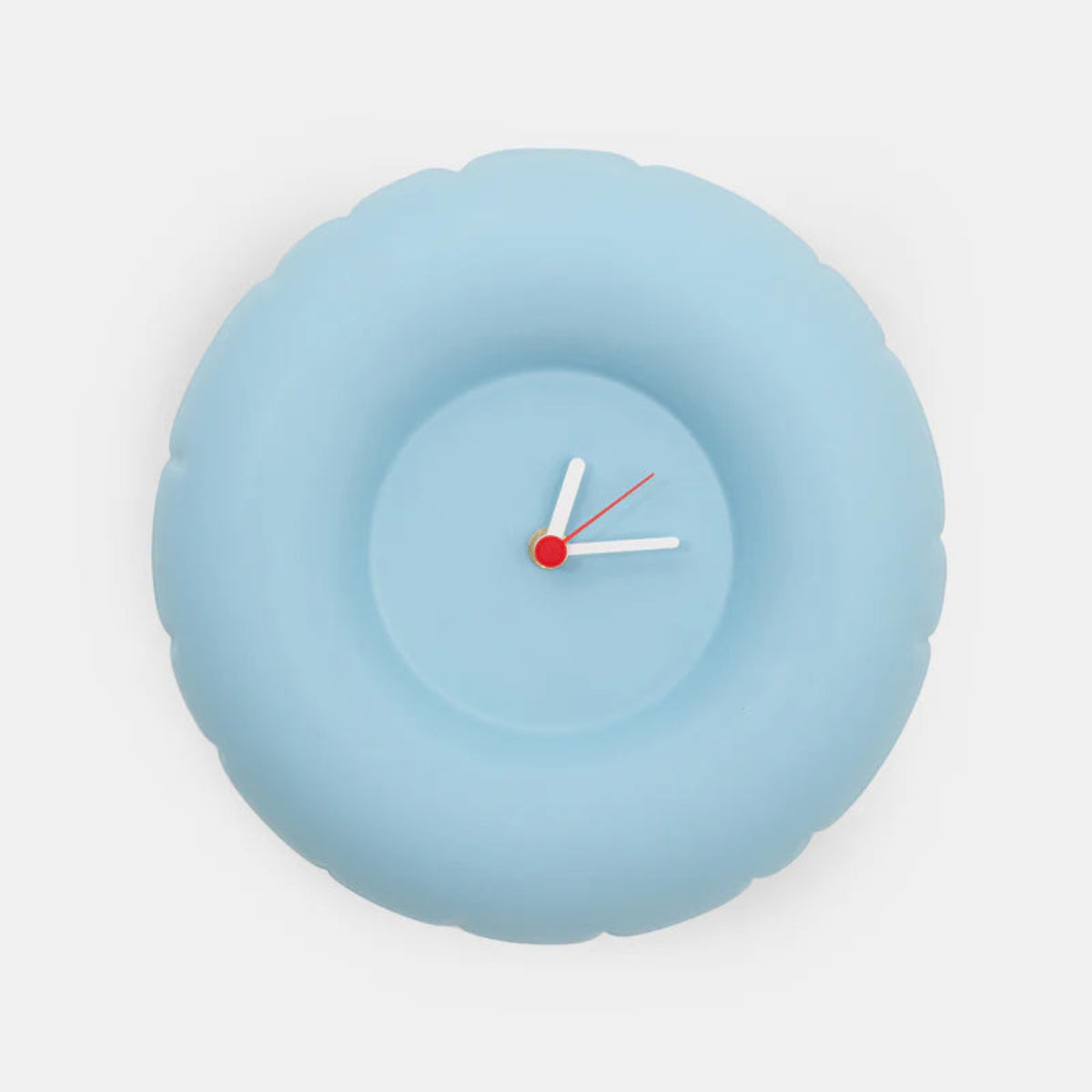 Light blue minimalist wall clock with white hands on a white background 