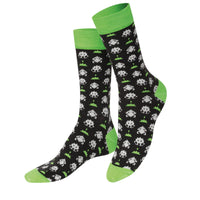 A pair of black and green socks with a game character pattern.