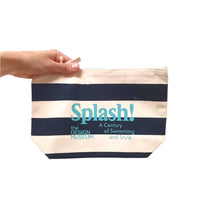 Splash Zip Pouch Navy Blue Stripe hold by a human hand on white background