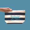 Splash Zip Pouch Navy Blue Stripe hold by a hand on blue background