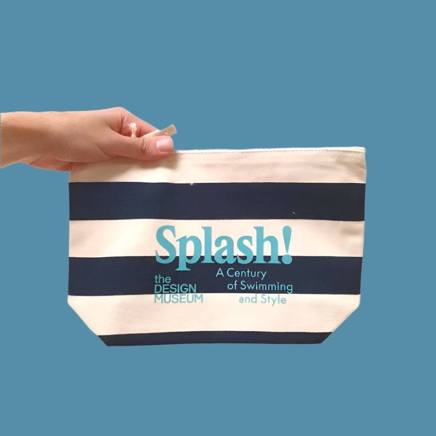 Splash Zip Pouch Navy Blue Stripe hold by a hand on blue background