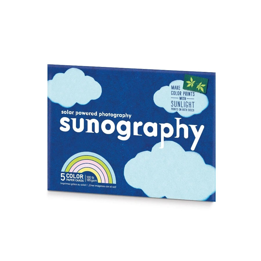 A pack of Sunography paper with a blue and white cloud-patterned design, labeled for creating artwork with sunlight.