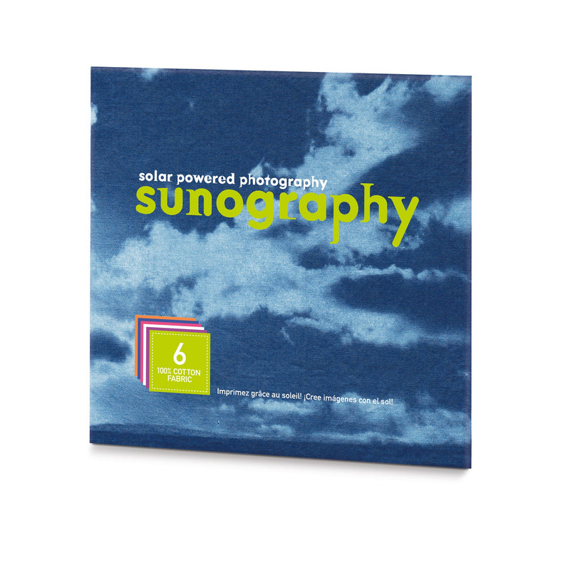 Packaging for Sunography fabric kit with a blue cloudy background and green text.