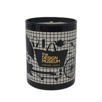 A black scented candle with a geometric pattern design, labeled 'the Design Museum Shop, EYVERMORE LONDON'.