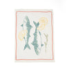 Tea towel with fish and lemon design on a white background