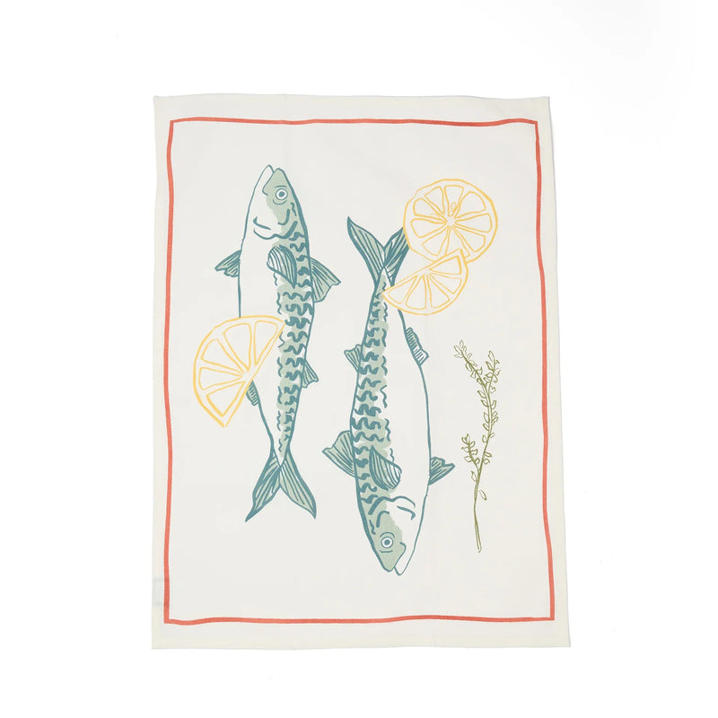 Tea towel with fish and lemon design on a white background