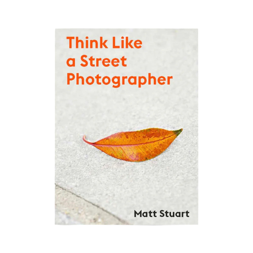 Cover of the book "think like a street photographer" by Matt Stuart, blow up picture of a faded leaf on sidewalk.