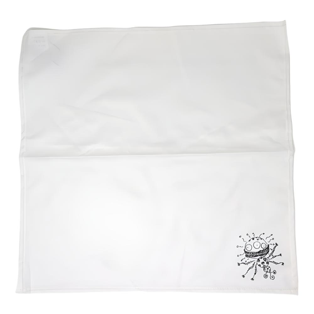 Alien illustration by Tim Burton on a white linen napkin