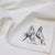 White linen napkin close-up with Tim Burton illustration