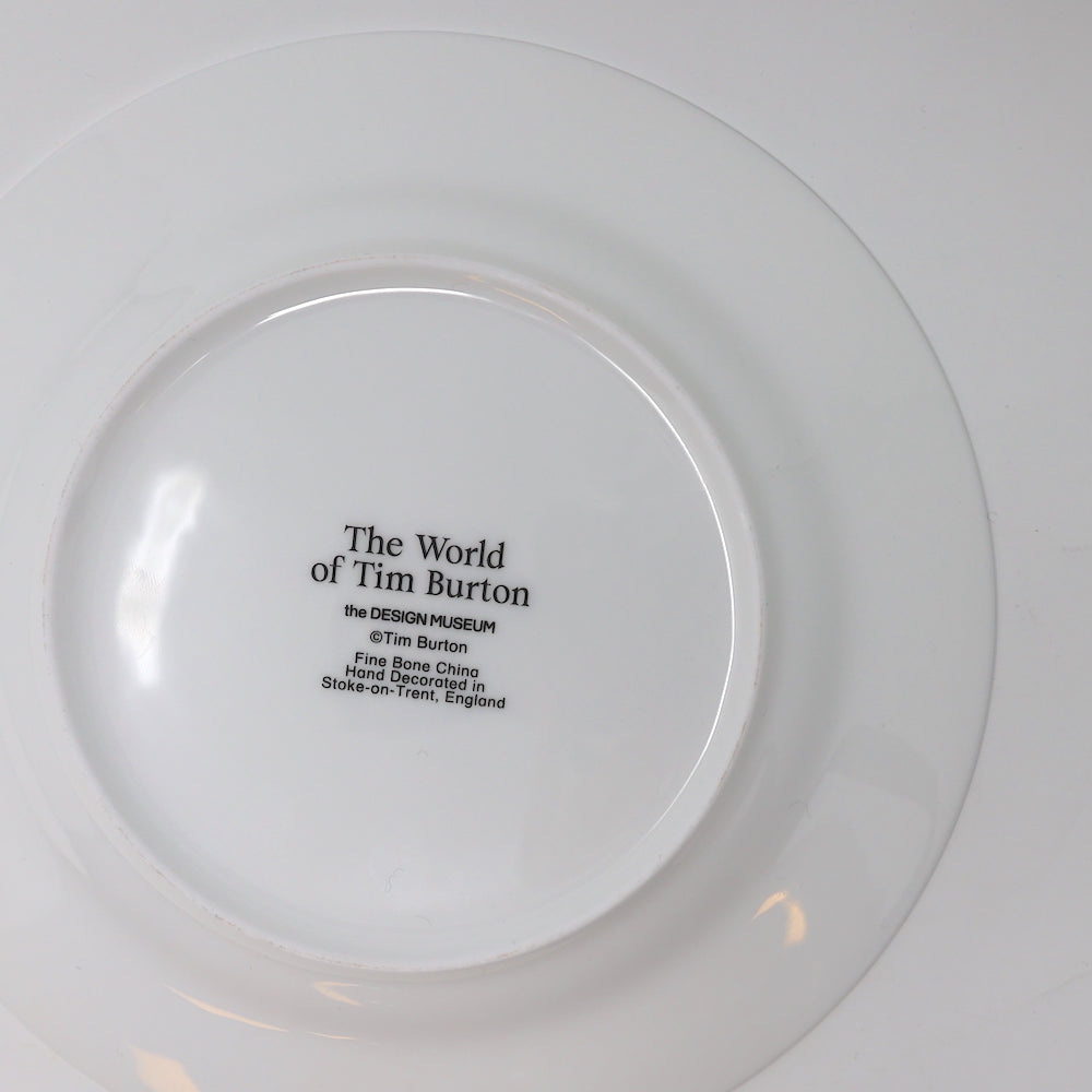 Back of fine china plate featuring Tim Burton exhibition stamp