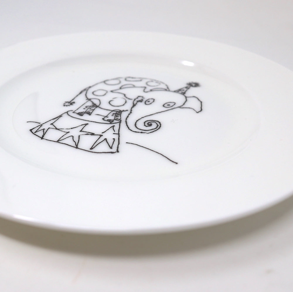 Close up of a china plate with Tim Burton illustration