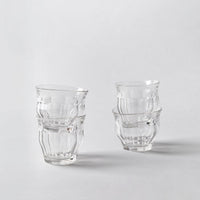 four glasses on a white background