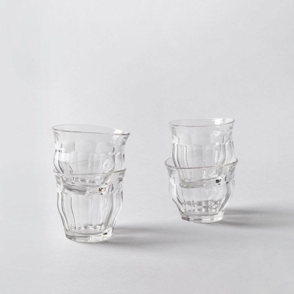 four glasses on a white background