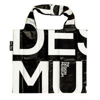 A reusable tote bag with a bold black and white graphic print featuring the words 'DESIGN MUSEUM'. The bag has a glossy, slightly reflective finish and is shown against a plain white background.