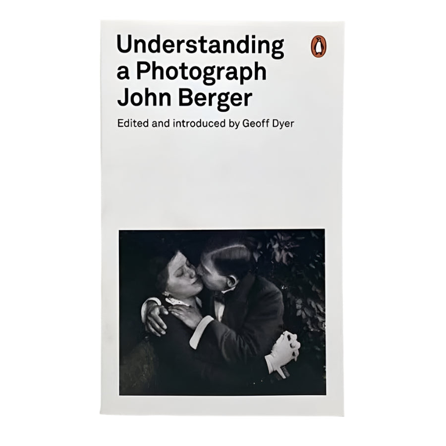 Understanding a Photograph Book by John Berger and edited by Geoff Dyer,  book has a picture of an early 20th century guy kissing a a woman with eyes closed