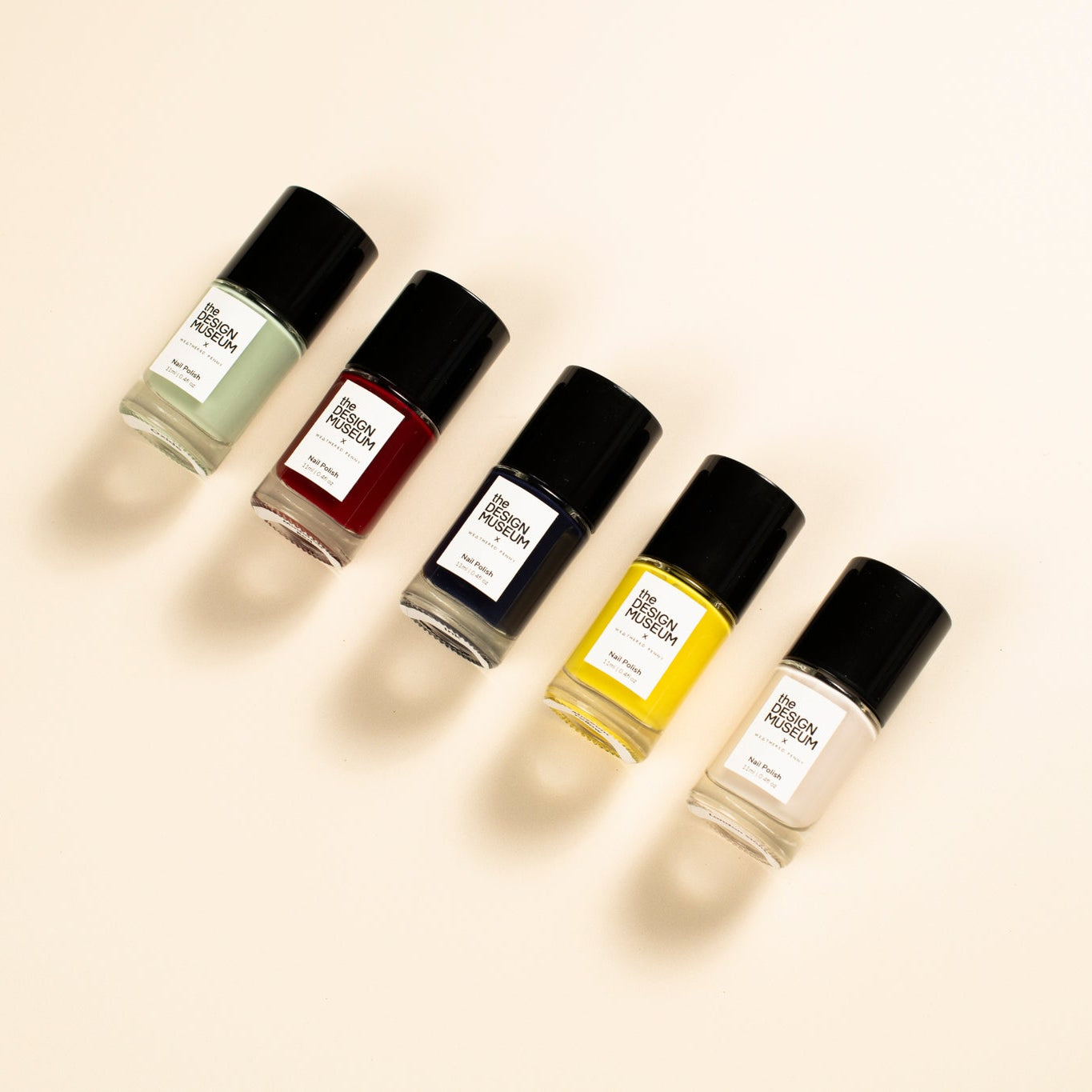 Nail varnishes on a cream background