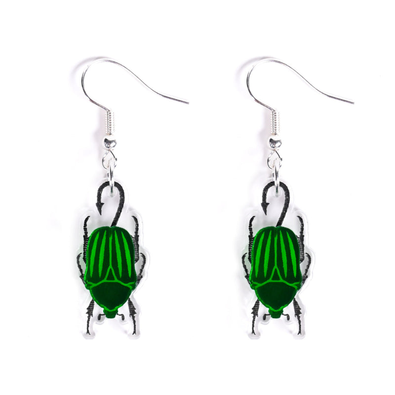 Green beetle-shaped earrings on a white background