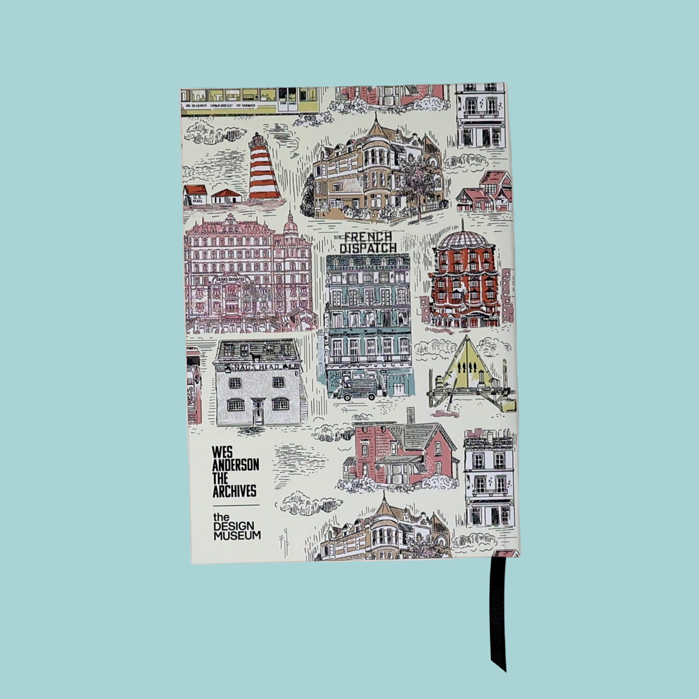 Notebook with illustrated cityscape design on a white background