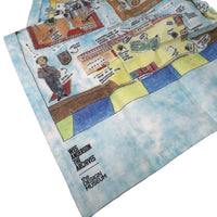 Tea towel with colorful illustrations on a white surface