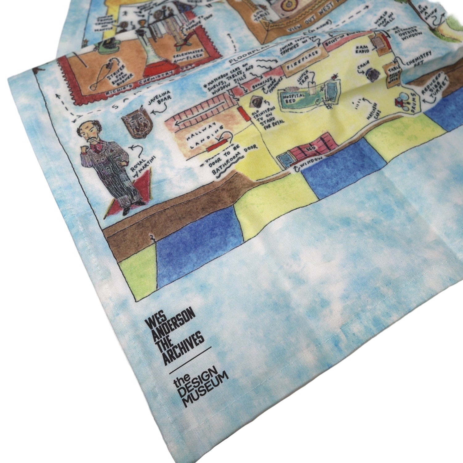 Tea towel with colorful illustrations on a white surface