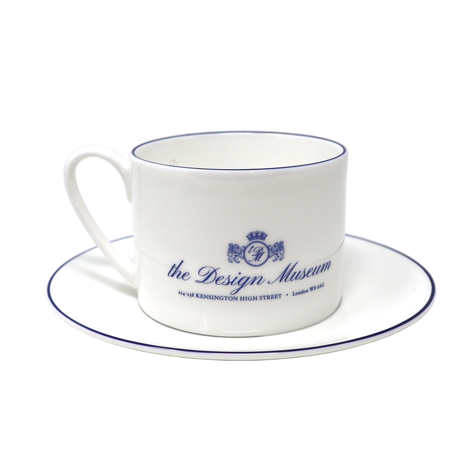 White teacup and saucer with blue text and design on a white background