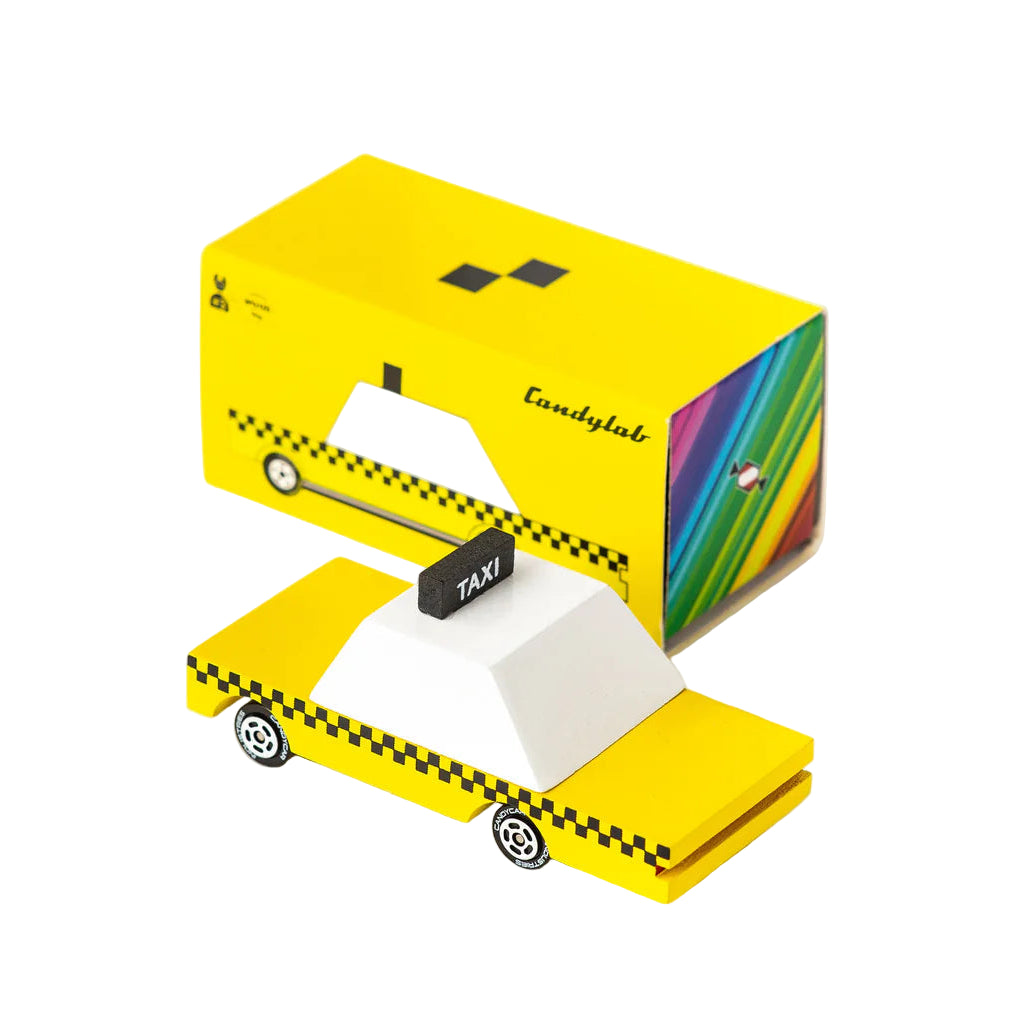 Yellow taxi-themed candy bar packaging with colorful candy inside on a white background