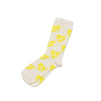 White sock with yellow heart patterns on a white background