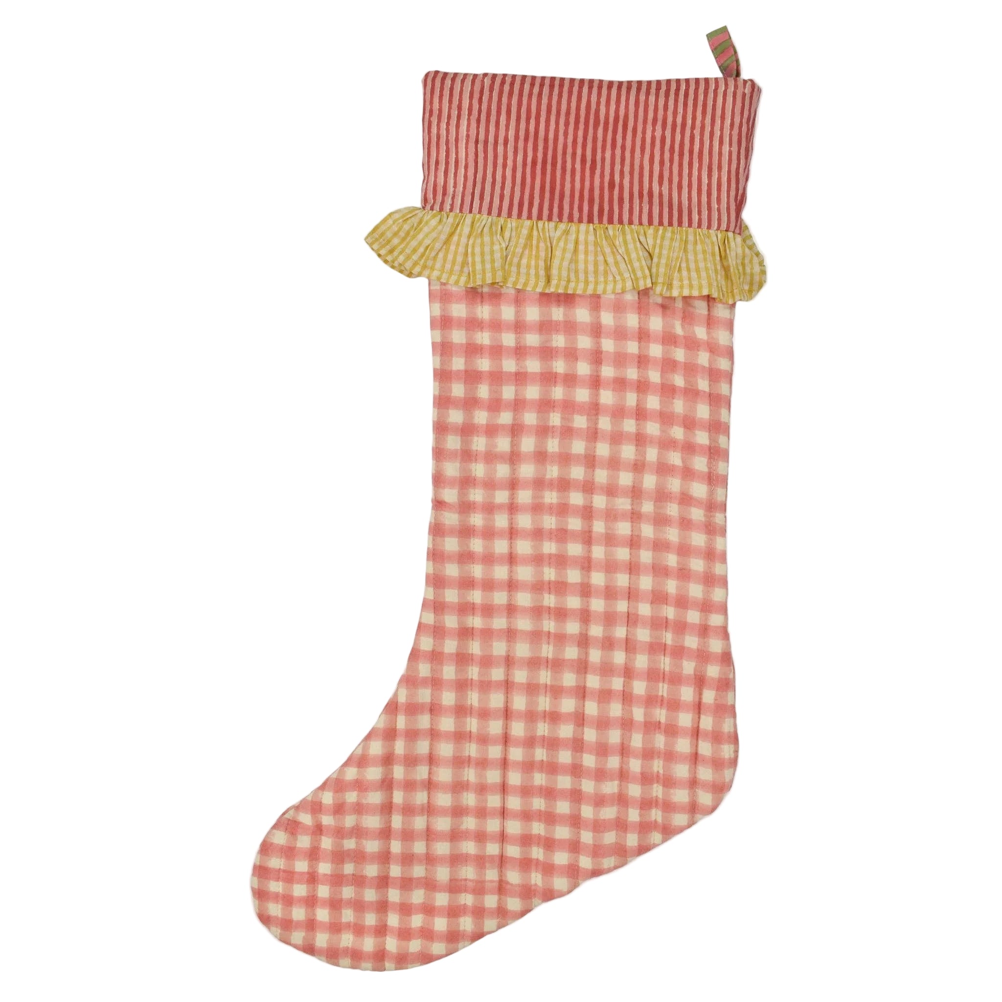 Red and white checkered Christmas stocking with a yellow trim on a white background