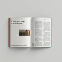 Open book on a gray background with text and a photo of a person.