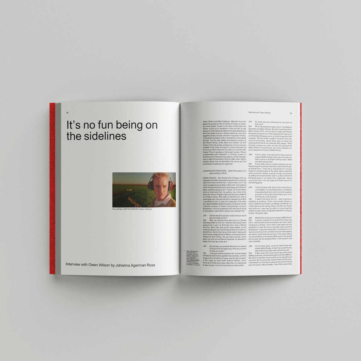 Open book on a gray background with text and a photo of a person.