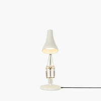 Small table lamp with a white shade on a white background