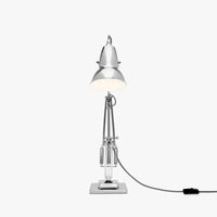 Silver desk lamp with a white background