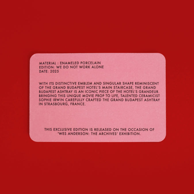 Pink rectangular certificate of authenticity on a red background
