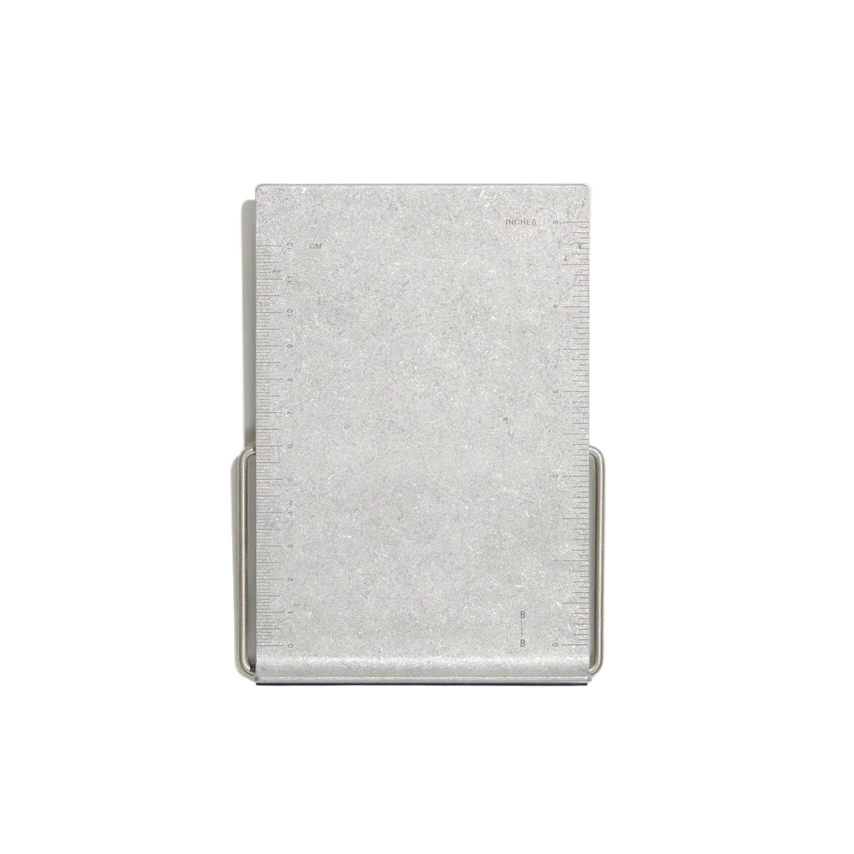 A minimalist silver metal bookstand, shown on a light gray background.