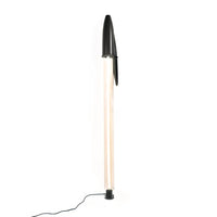 Black BIC pen floor lamp on a white background
