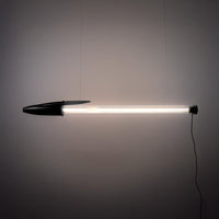 Black BIC pen lamp hanging against a grey wall.
