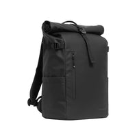 A black waterproof roll-top backpack on a light grey background. 