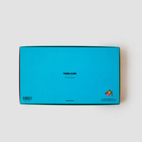 The back of a blue jigsaw box with branding on a light gray background
