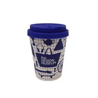 Reusable blue and white cup with blue lid featuring design museum branding on a white background