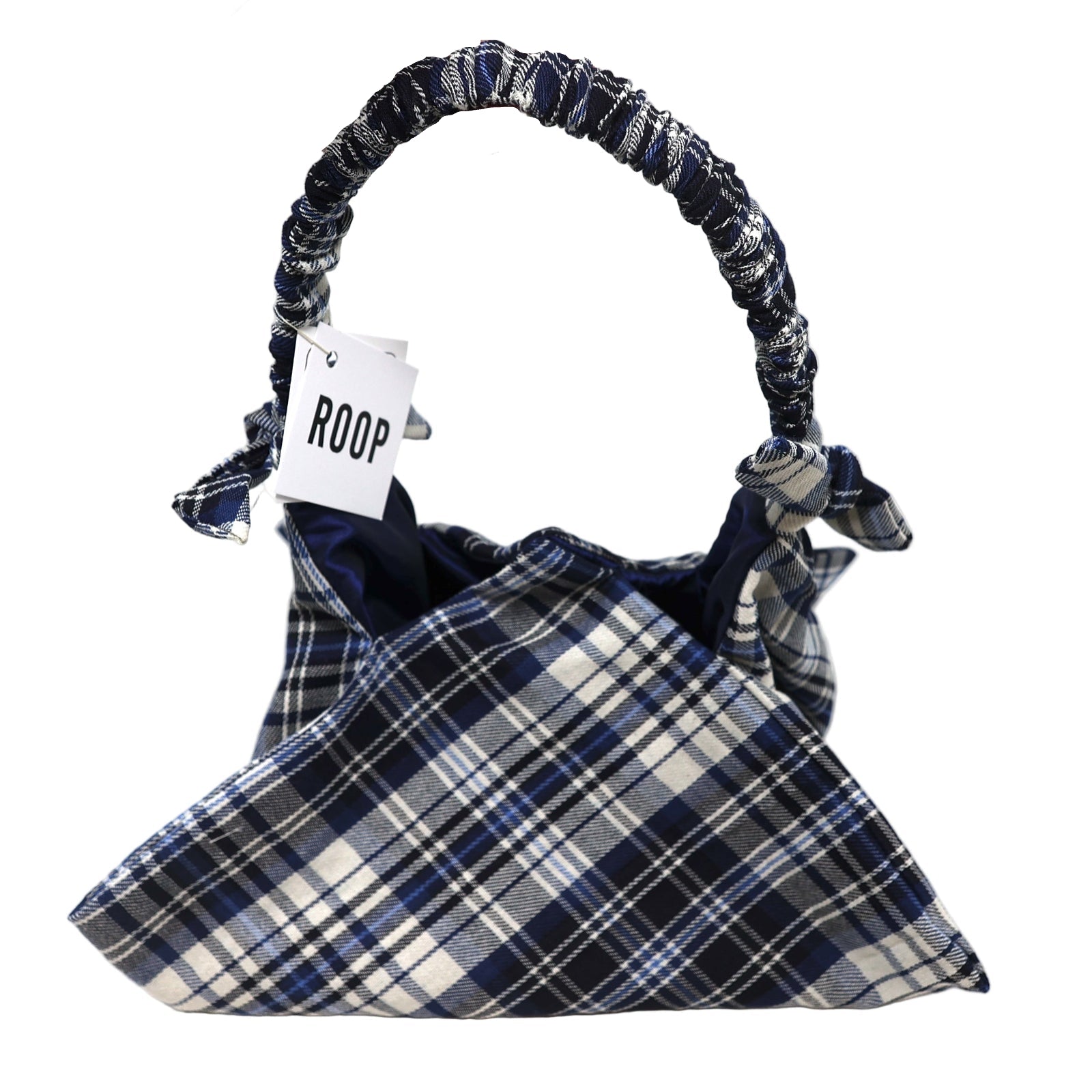 Plaid handbag with 'ROOP' tag held by a hand on a white background