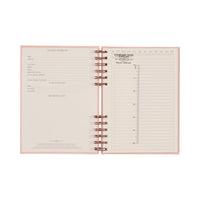 Open spiral-bound notebook with lined pages on a white background